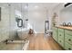 Bright bathroom featuring a soaking tub, glass-enclosed shower, and double vanity sinks at 2208 Mountain Springs Nw Ct, Kennesaw, GA 30144