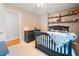 bedroom with playful decor, wood shelves and a ceiling fan at 2208 Mountain Springs Nw Ct, Kennesaw, GA 30144