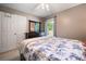 Cozy bedroom with a ceiling fan, a large window and a neutral color scheme at 2208 Mountain Springs Nw Ct, Kennesaw, GA 30144