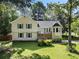 Charming two-story home with manicured lawn and inviting front porch at 2208 Mountain Springs Nw Ct, Kennesaw, GA 30144