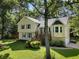 Attractive home featuring a well-maintained lawn and a front porch at 2208 Mountain Springs Nw Ct, Kennesaw, GA 30144