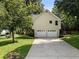 Image of a two-car garage with a long drive way at 2208 Mountain Springs Nw Ct, Kennesaw, GA 30144