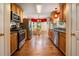 Bright kitchen features wooden cabinetry, stainless steel appliances, granite countertops, and a breakfast nook at 2208 Mountain Springs Nw Ct, Kennesaw, GA 30144