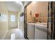 Laundry room with front-load washer and dryer and wood-look tile flooring at 2208 Mountain Springs Nw Ct, Kennesaw, GA 30144