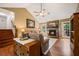 Inviting living room with hardwood floors, stone fireplace, and plenty of natural light at 2208 Mountain Springs Nw Ct, Kennesaw, GA 30144