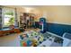 Fun play area with an animal themed rug and lots of toy storage at 2208 Mountain Springs Nw Ct, Kennesaw, GA 30144