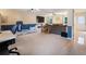 Large carpeted living room featuring a wall mounted TV, and a door leading to the exterior at 2208 Mountain Springs Nw Ct, Kennesaw, GA 30144