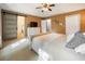 The primary bedroom with a large bed, wooden dresser, and frosted sliding door at 2208 Mountain Springs Nw Ct, Kennesaw, GA 30144