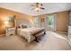 The main bedroom has a luxurious upholstered headboard and a soft neutral color palette at 2208 Mountain Springs Nw Ct, Kennesaw, GA 30144