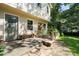 Back door with flagstone patio, bench, garden box and firepit at 2208 Mountain Springs Nw Ct, Kennesaw, GA 30144