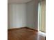 Bedroom with hardwood floors, natural light and sliding glass door at 2917 Katherine Valley Rd, Decatur, GA 30032
