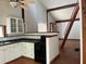 Kitchen view of white cabinets and an opening to living room at 2917 Katherine Valley Rd, Decatur, GA 30032