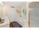 Bright bathroom with a large soaking tub, separate shower, double vanity and a large window with natural light at 9125 Patrick Pl, Winston, GA 30187