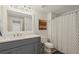 Neutrally decorated bathroom featuring shower/tub combination and shaker vanity with solid surface countertop at 9125 Patrick Pl, Winston, GA 30187