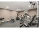 Exercise room with a variety of workout equipment and machines, including a treadmill and weight machines at 9125 Patrick Pl, Winston, GA 30187