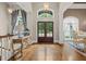 Elegant foyer with hardwood floors, large windows, and a decorative console table at 9125 Patrick Pl, Winston, GA 30187