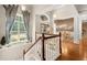 A beautiful foyer with hardwood floors, a staircase, lots of natural light, and open views to the dining room at 9125 Patrick Pl, Winston, GA 30187