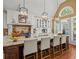 Bright kitchen with large island, barstool seating, and stainless steel appliances at 9125 Patrick Pl, Winston, GA 30187