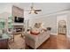 Cozy living room with stone fireplace, hardwood floors, and comfortable seating at 9125 Patrick Pl, Winston, GA 30187
