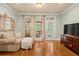 Sitting area with large television and lots of natural light at 9125 Patrick Pl, Winston, GA 30187