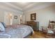 Comfortable bedroom with a rocking chair, hardwood floors, and neutral paint color at 2429 Kirk Nw Ln, Kennesaw, GA 30152