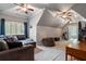 Upstairs bonus room with vaulted ceilings, ample space for lounging, and workout equipment at 2429 Kirk Nw Ln, Kennesaw, GA 30152