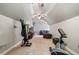 Spacious bonus room boasts vaulted ceilings and is equipped with workout equipment at 2429 Kirk Nw Ln, Kennesaw, GA 30152