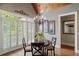 Breakfast nook featuring beamed ceiling, plantation shutters, and chandelier at 2429 Kirk Nw Ln, Kennesaw, GA 30152