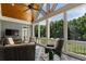 Enclosed porch with a ceiling fan and an outdoor sitting area with view to yard at 2429 Kirk Nw Ln, Kennesaw, GA 30152