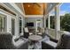 Outdoor porch with television and comfortable seating area at 2429 Kirk Nw Ln, Kennesaw, GA 30152