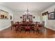 Formal dining room with wainscoting, chandelier, and ample seating for elegant dinners at 2429 Kirk Nw Ln, Kennesaw, GA 30152