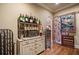 Dining area features hardwood floors, ornate wine racks and vintage furniture at 2429 Kirk Nw Ln, Kennesaw, GA 30152