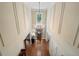 Dramatic two-story foyer with hardwood floors, chandelier, and transom window at 2429 Kirk Nw Ln, Kennesaw, GA 30152