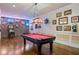 Game room with a pool table, vintage brick, and collection of neon beer signs at 2429 Kirk Nw Ln, Kennesaw, GA 30152