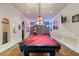 Spacious game room features a pool table, vintage brick, and unique neon beer signs at 2429 Kirk Nw Ln, Kennesaw, GA 30152