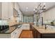 Bright kitchen featuring an island with granite countertops, stainless steel appliances, and farmhouse sink at 2429 Kirk Nw Ln, Kennesaw, GA 30152
