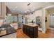 Modern kitchen with stainless steel appliances, granite countertops and beautiful hardwood floors at 2429 Kirk Nw Ln, Kennesaw, GA 30152