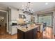 Open kitchen with granite countertops, stainless steel appliances, and a kitchen island at 2429 Kirk Nw Ln, Kennesaw, GA 30152