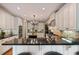 Large kitchen with island, bar seating, stainless appliances and custom cabinets at 2429 Kirk Nw Ln, Kennesaw, GA 30152