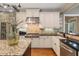Beautiful white kitchen with granite countertops, stainless steel appliances, and hardwood floors at 2429 Kirk Nw Ln, Kennesaw, GA 30152