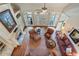 Aerial view of a bright and airy living room with fireplace and hardwood floors at 2429 Kirk Nw Ln, Kennesaw, GA 30152