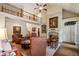Open living room with loft view, stone fireplace, built-in cabinets, and abundant seating at 2429 Kirk Nw Ln, Kennesaw, GA 30152