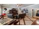 A spacious living room with a TV, comfortable seating, and eye-catching tile and wood floors at 2429 Kirk Nw Ln, Kennesaw, GA 30152