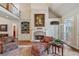 Cozy living room with fireplace, built-in shelving, and comfortable seating arrangement at 2429 Kirk Nw Ln, Kennesaw, GA 30152