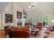 Spacious living room with fireplace, hardwood floors, built-in shelving and lots of natural light at 2429 Kirk Nw Ln, Kennesaw, GA 30152