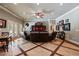 Entertain in this comfy living room with tile and wood floors, TV area, and easy access to the patio at 2429 Kirk Nw Ln, Kennesaw, GA 30152