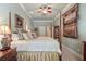 Cozy main bedroom with a four-poster bed, soft lighting, and neutral paint at 2429 Kirk Nw Ln, Kennesaw, GA 30152