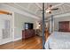 Spacious main bedroom with hardwood floors, trey ceiling, sitting area, and patio access at 2429 Kirk Nw Ln, Kennesaw, GA 30152