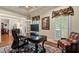 Well-appointed office space with French doors, custom window treatments, and a large desk at 2429 Kirk Nw Ln, Kennesaw, GA 30152