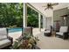 Inviting outdoor patio with comfortable chairs overlooking a beautiful pool area at 2429 Kirk Nw Ln, Kennesaw, GA 30152